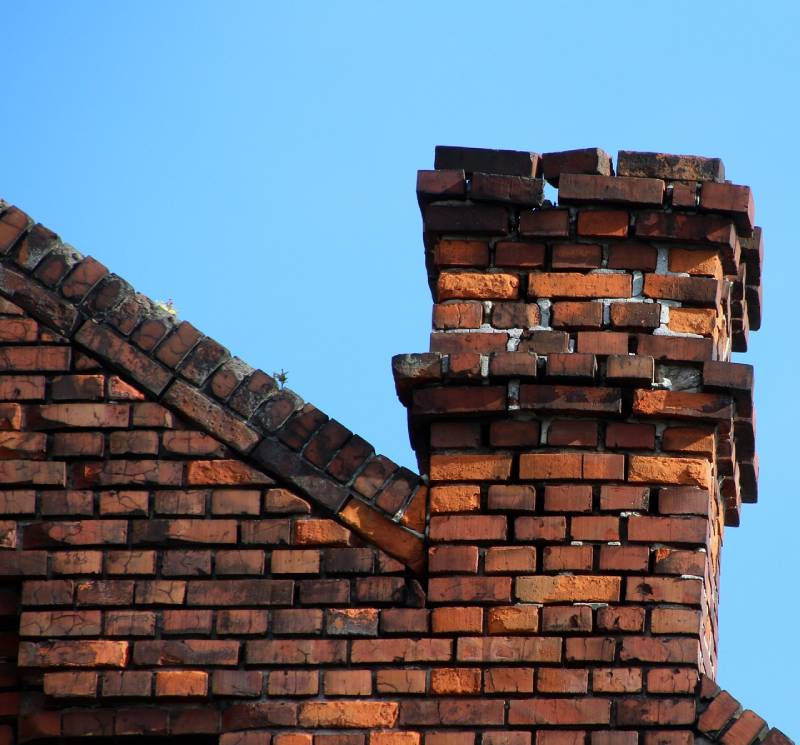 Signs Your Bridgewater Home Needs a Chimney Inspection Damaged chimney on an Bridgewater home showing cracks and missing mortar